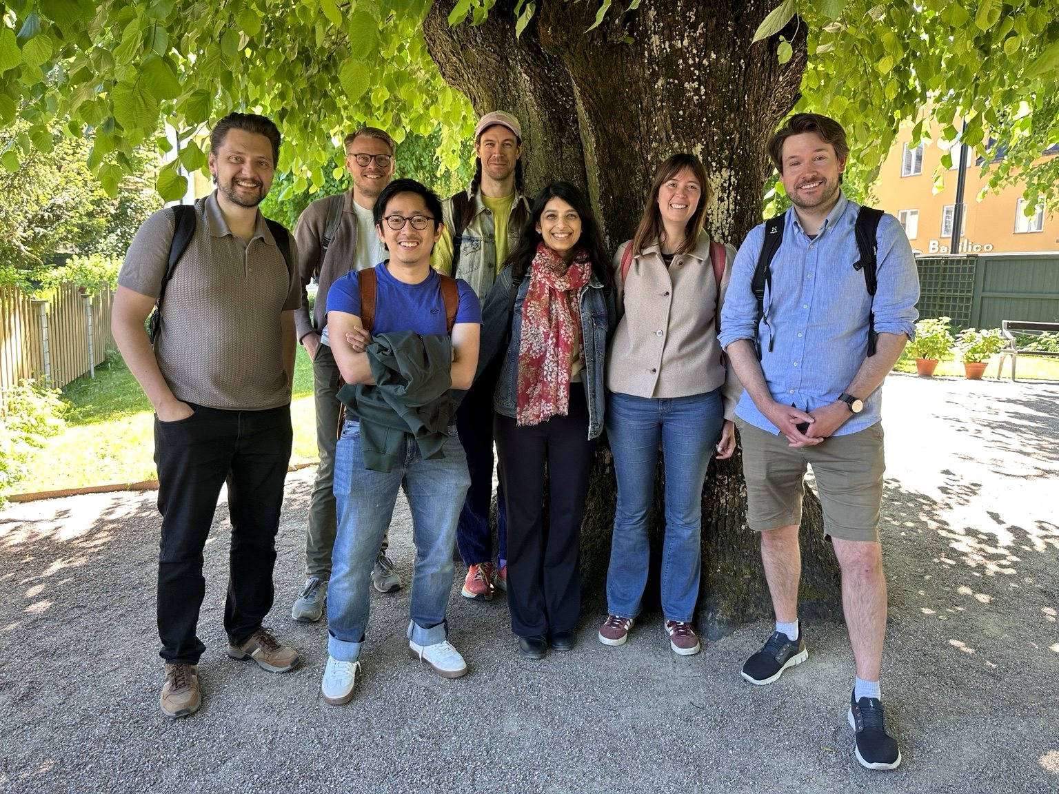 Biodiversity Data Lab team standing beneath a leafy tree